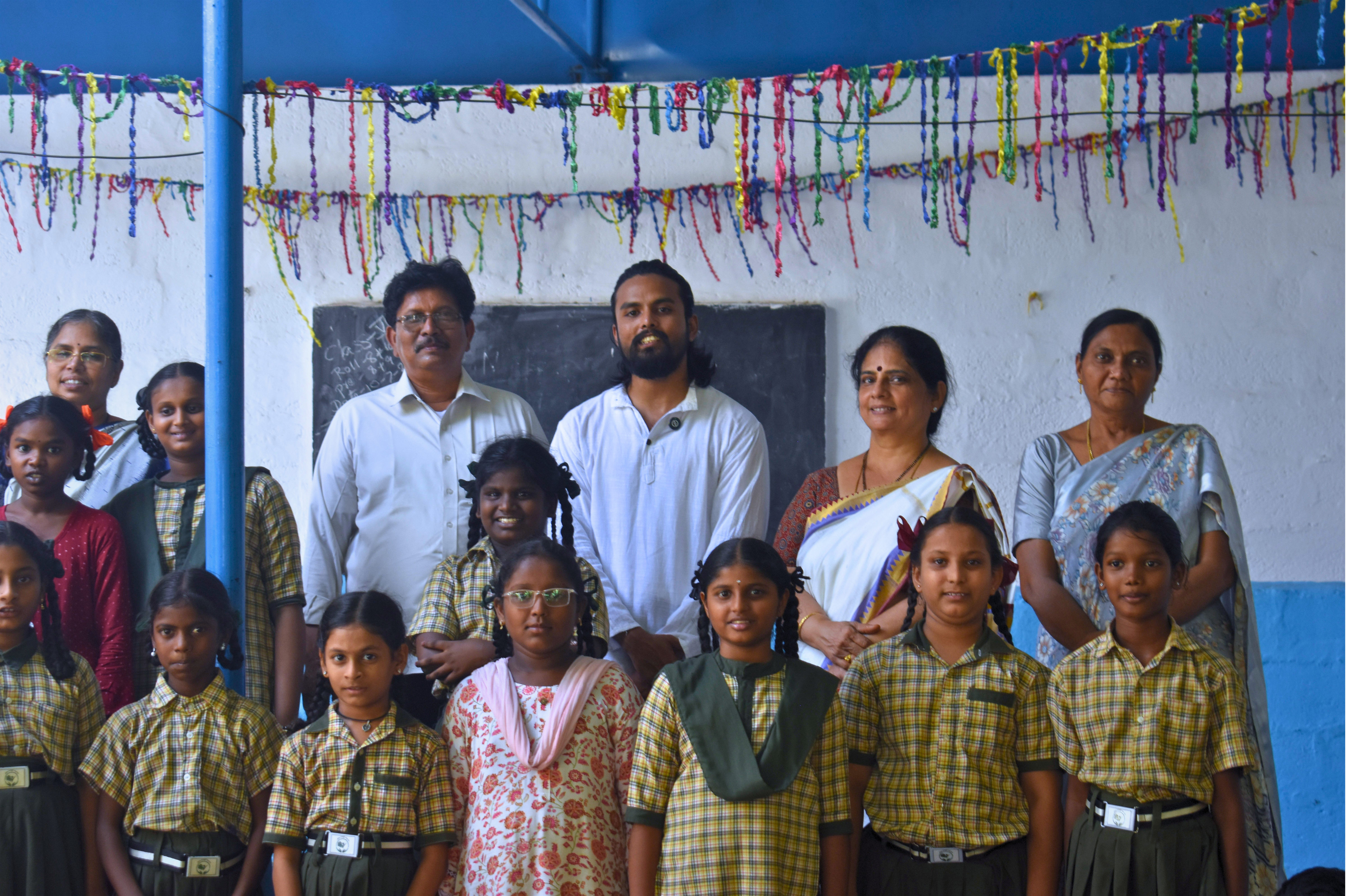 Sai Teja conducting a student yoga and meditation workshop at R.A.U.P School